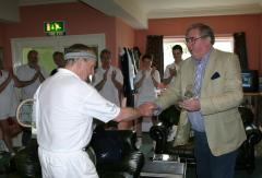 Brian Rich receiving trophy